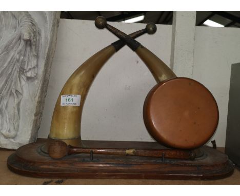 A dinner gong formed from 2 horns on wooden plinth; a small turned mahogany plant stand 