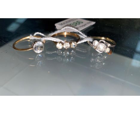 Three gem set dress rings, 3.4 gm; a pearl effect stick pin, boxed 