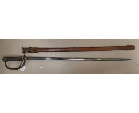 A WWI officer's dress sword Royal Artillery ; a pair of spurs Blade generally good with decoration clear - some wear and blac