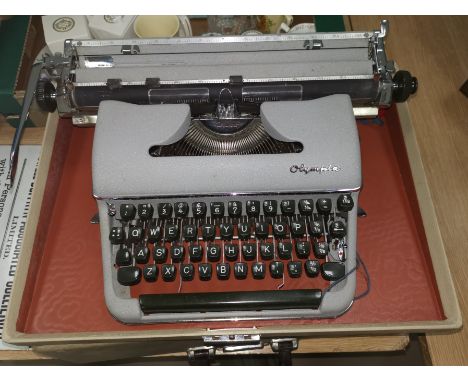 A 1950's Olympia portable typewriter in original box 