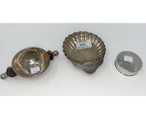 A silver scallop shell bon-bon dish, Birmingham 1911; a silver circular trinket box, engine turned, Birmingham 1911, total 2.