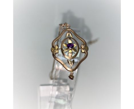 An Edwardian style pendant set amethyst, stamped '9ct', on fine chain 