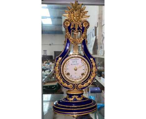 A ceramic clock, reproduction of the V&amp;A Museum Marie-Antoinette clock, height 38 cm 