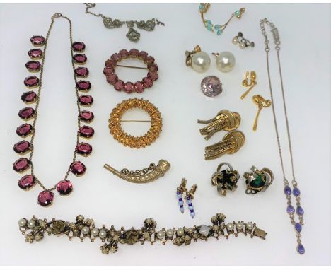 An amethyst colour necklace, brooches, earrings etc 