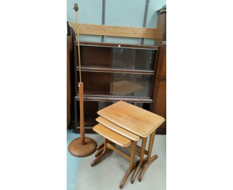 A teak and brass standard lamp; a nest of vintage tables 