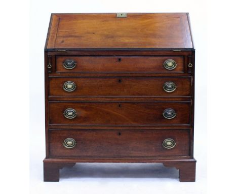 A 19TH CENTURY MAHOGANY BUREAU the fall front enclosing a fitted interior over four long drawers and standing on bracket feet