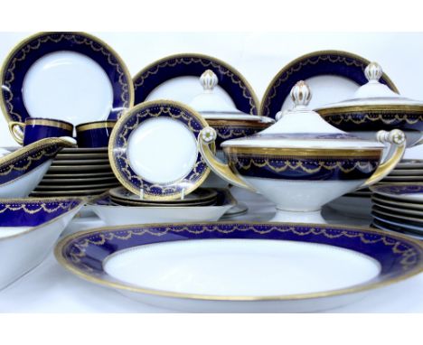 AN EXTENSIVE HUTSCHENREUTER PORCELAIN DINNER SERVICE with blue and gilt borders, consisting of twenty seven dinner plates, th