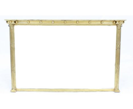 A REGENCY STYLE GILDED OVERMANTLE MIRROR with fluted columns and bevelled glass 134cm wide x 84cm high 