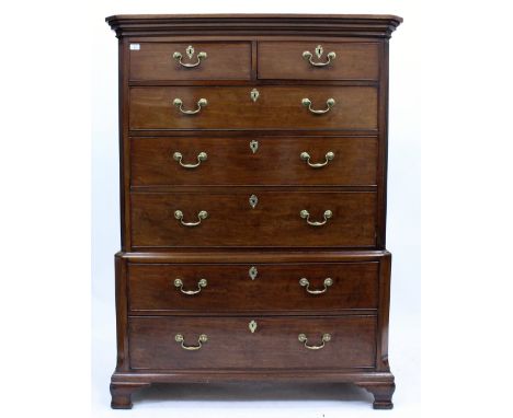 A GEORGE III MAHOGANY TALLBOY with two short and five long drawers having brass swan neck handles and raised on ogee bracket 