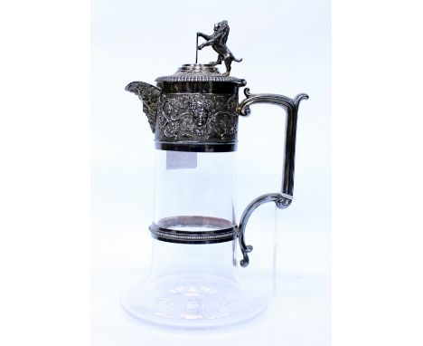 AN ELKINGTON & CO. CUT GLASS CLARET JUG with silver plated mounts, a face mask spout and a lion and crest finial 27cm in heig