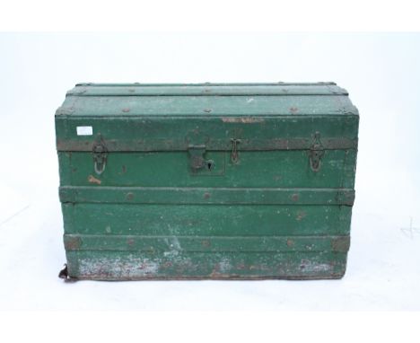 A GREEN PAINTED DOME TOPPED TRUNK with wooden banded decoration and contents therein to include carpentry tools, 20th century
