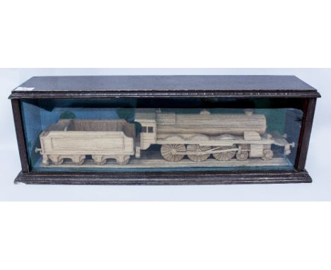A MATCHSTICK MODEL of a locomotive and tender in a glazed display case 66cm wide x 21cm high
