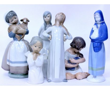 A ROYAL COPENHAGEN PORCELAIN FIGURINE depicting a young girl and a doll model No. 1938 12.5cm in height, two Lladro porcelain