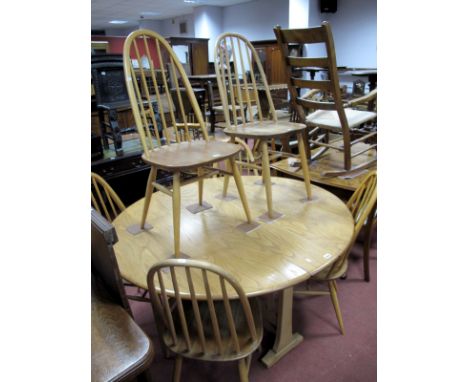 Six Ercol Hoop Back Light Ash/Elm Dining Chairs, each with five spindles on splayed legs united by 'H' stretcher.