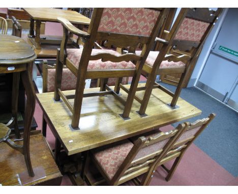 An Oak Dining Suite, by 'Georgian Style Ltd' of Derbyshire, complete with four single and two carver wavy ladder back chairs,