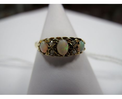 An 18ct Gold Opal and Diamond Set Ring, graduated set.