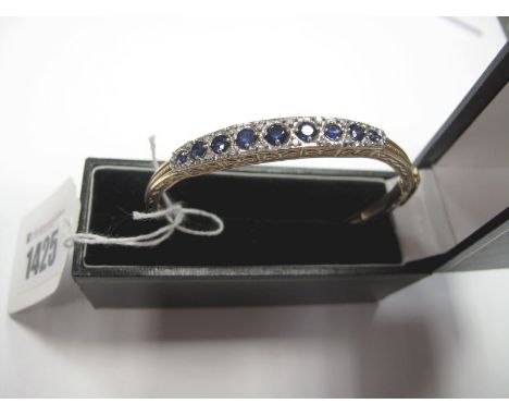 A Victorian Style Sapphire and Diamond Set Bangle, claw set, with allover textured and openwork design, to hinged snap clasp,