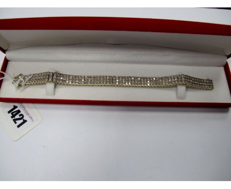 A Modern Diamond Set Line Bracelet, of three row design, set with brilliant cut stones, claw set throughout, to snap clasp, s