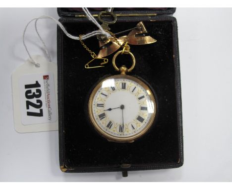 A Ladies Fob Watch, the undersigned decorative white dial, with black Roman numerals, in foliate engraved case, stamped "18K"