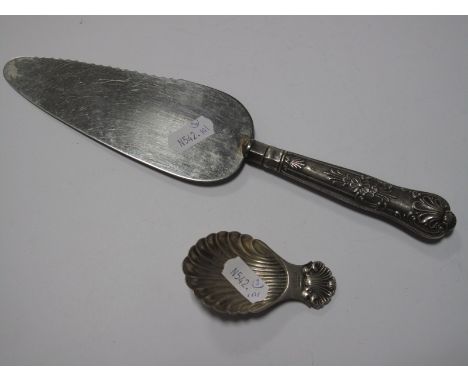 A Hallmarked Silver Handled Cake Slice; a hallmarked silver dish 'Mastell Co 1715-1965" and a shell bowl caddy spoon. (3)