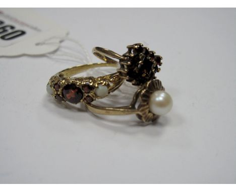 A 9ct Gold Dress Ring, claw set highlights, between tapered shoulders, a 9ct gold imitation pearl ring with flowerhead border