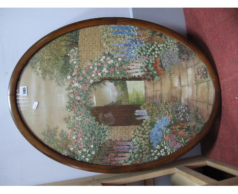 An Oval Needlework Picture of A Gate to The Garden, in mahogany frame, 68.5 x 48cm.