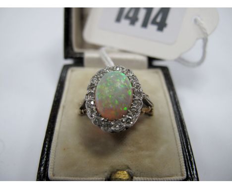 An Opal and Diamond Cluster Ring, the central oval cabochon (cracked) within illusion border of old and single cut diamonds, 