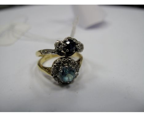 A Sapphire and Diamond Three Stone Ring, graduated claw and illusion set between crossover shoulders; An 18ct Gold Blue Zirco