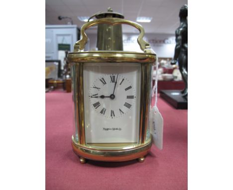 A Mappin &amp; Webb Ltd Brass Oval Shaped Carriage Clock.