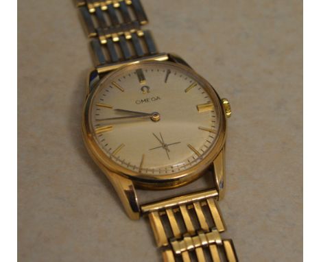 9ct gold Omega gents wristwatch on a 9ct gold gate style strap (hallmarked body and strap) with engraving to watch back plate