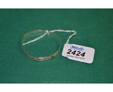 A white metal child's Bangle