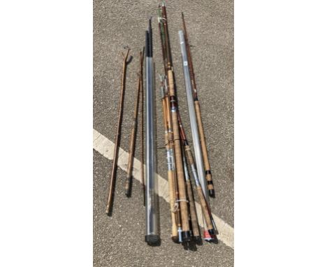 A quantity of vintage fishing rods and thumb stick