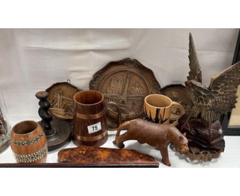 A quantity of wooden carved items including Plaques, eagle, cat candlestick holder etc