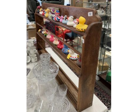 A wooden 3 shelf wall mounted plate display rack