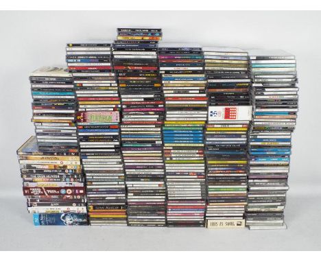 A large quantity of compact discs and a small quantity of DVDs to include The Who, The Doors, Bob Dylan, Ray Charles, The Kin