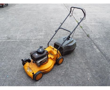 A Partner 431 lawn mower with Briggs &amp; Stratton engine.