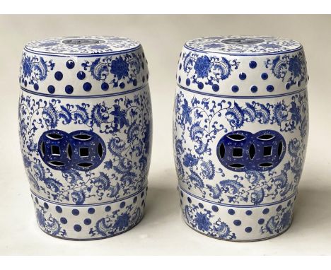 CHINESE GARDEN STOOLS, a pair, blue and white ceramic, barrel shaped and pierced, 46cm H. (2) 