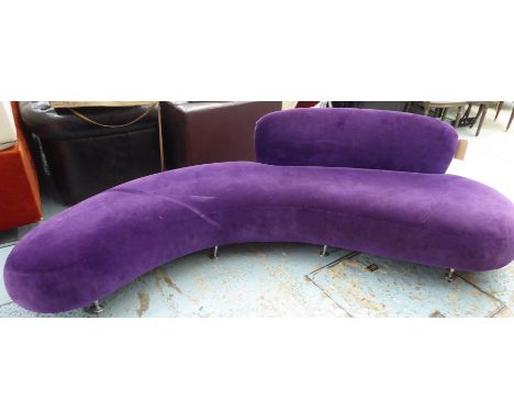 SOFA, purple velvet of curved form, 280cm W x 73cm H. (feet pads missing on rear legs) 