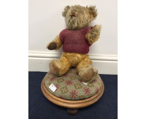 A vintage mohair bear on stool