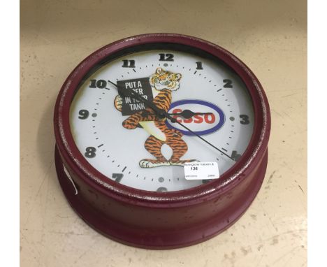 A clock advertising Esso