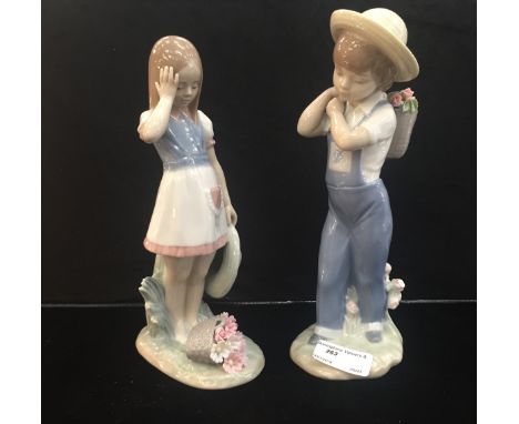 Two Lladro figures: a boy and girl with flowers