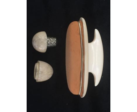 An ivory thimble holder and silver thimble by Pepys &amp; Co; together with an ivory nail buffer, c1930