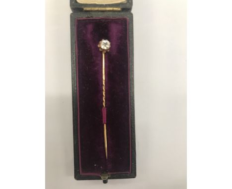 A cased stick pin