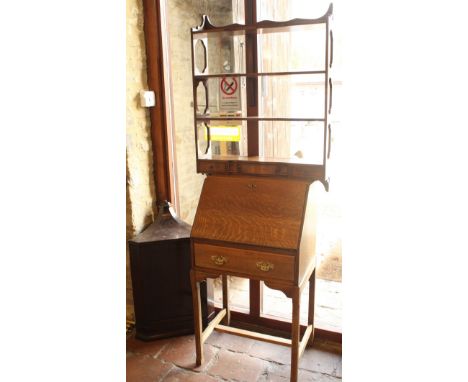 A 20th Century oak bureau, modern mahogany shelf unit and an Edwardian hanging corner cupboard