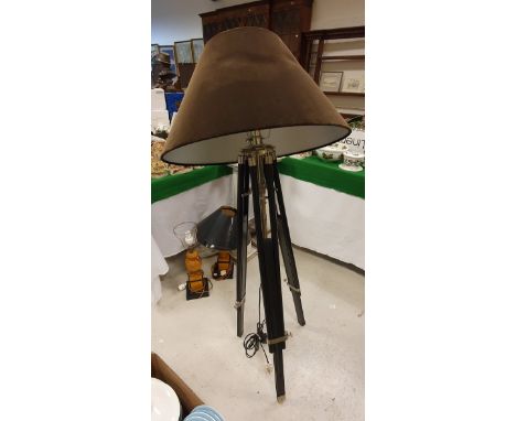 A modern adjustable ebonised tripod standard lamp as a theodolite or telescope stand