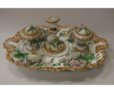 A Victorian Coalbrookedale style desk stand, set with candlestick and two inkwells, all with floral encrusted decoration