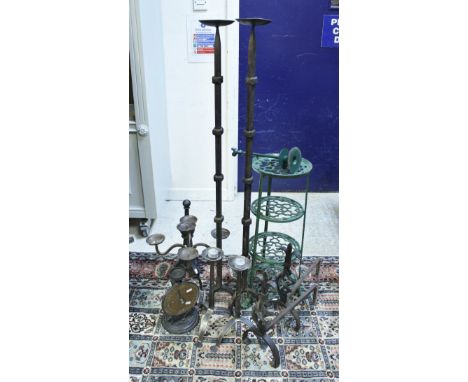 A pair of wrought iron tripod floor standing candle stands, painted pot stand, vegetable rack, three various door stops, pair