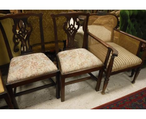 Two 18th Century provincial mahogany Chippendale style dining chairs and an early 20th Century caned bergere chair