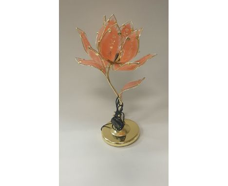 A mid to late 20th Century brassed table lamp of lotus flower form, together with the matching standard lamp and a gilt frame