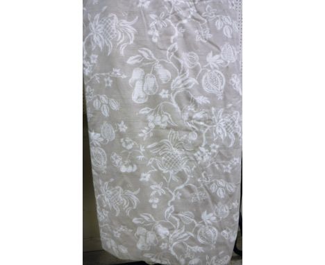 A pair of linen type beige ground with cream fruit decoration curtains, interlined, with fixed triple pinch pleat headings, a